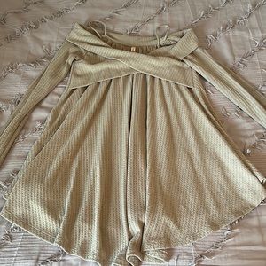 Long-sleeve, off the shoulders shirt.